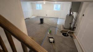 Completed basement flooding recovery in Spanish Fork home with new drywall, fresh paint, and dedicated sump pump installation