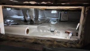 Crawlspace vapor barrier installation with dehumidification for mold prevention in Utah residential property